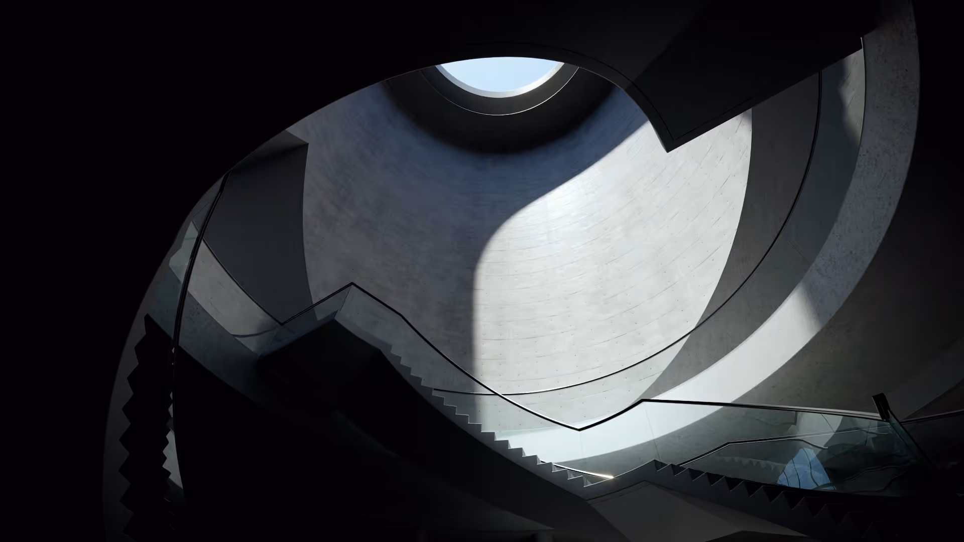 Curving interior staircase beneath a circular skylight