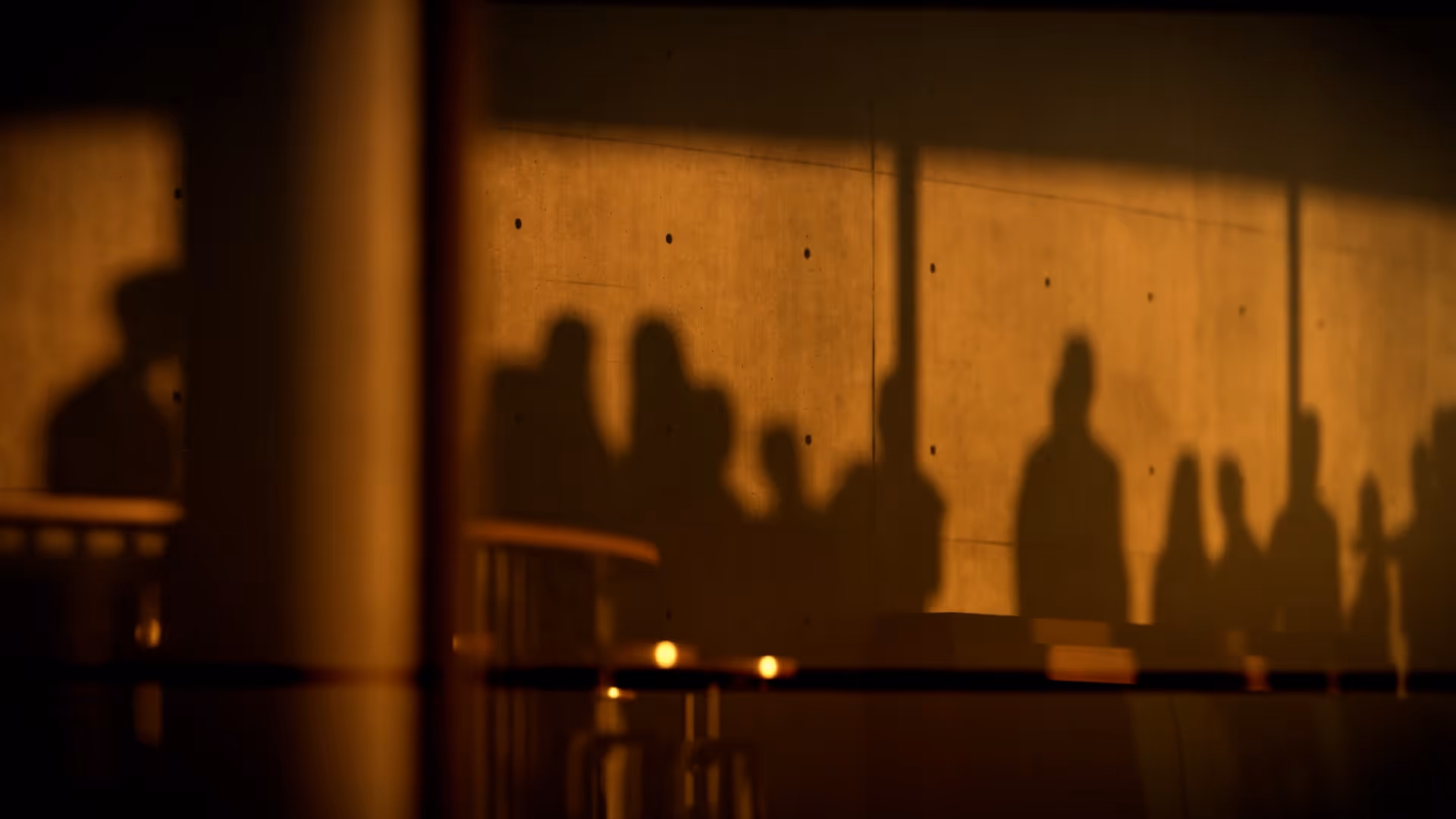 Warm silhouettes in a gallery at sunset